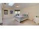 Cozy bedroom with carpeted floors and a white bed frame at 4766 S Atlantic Ave, Ponce Inlet, FL 32127