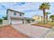 Charming single-Gathering home with a brick driveway and mature landscaping at 4766 S Atlantic Ave, Ponce Inlet, FL 32127