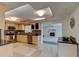 Modern kitchen with granite countertops and stainless steel appliances at 4766 S Atlantic Ave, Ponce Inlet, FL 32127
