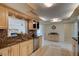 Bright kitchen with granite countertops and light wood cabinets at 4766 S Atlantic Ave, Ponce Inlet, FL 32127