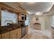 Bright kitchen with granite countertops and light wood cabinets at 4766 S Atlantic Ave, Ponce Inlet, FL 32127