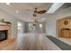 Spacious living room featuring hardwood floors and a fireplace at 4766 S Atlantic Ave, Ponce Inlet, FL 32127