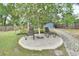 Relaxing backyard patio with brick pavers and seating at 714 E Michigan Ave, Deland, FL 32724