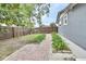 Private backyard with a brick pathway and neatly planted greenery at 714 E Michigan Ave, Deland, FL 32724