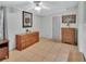 Bedroom with neutral tile floors, two dressers and natural light at 714 E Michigan Ave, Deland, FL 32724