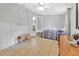 Cozy bedroom featuring tile floors, neutral walls, and a ceiling fan at 714 E Michigan Ave, Deland, FL 32724