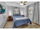 Comfortable bedroom with light wood flooring and neutral walls, with bright, natural light at 714 E Michigan Ave, Deland, FL 32724