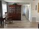 Dining room with rocking chair, a china cabinet, and wood-look tile floors at 714 E Michigan Ave, Deland, FL 32724