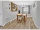 Bright dining area featuring wood-look flooring and a modern chandelier at 714 E Michigan Ave, Deland, FL 32724
