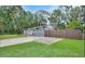 Cute ranch home with a fenced yard and paved driveway at 714 E Michigan Ave, Deland, FL 32724