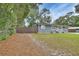 Updated home with a fenced yard and wood gate at 714 E Michigan Ave, Deland, FL 32724