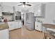 Renovated kitchen with stainless steel appliances and granite countertops at 714 E Michigan Ave, Deland, FL 32724