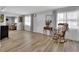 Bright living room featuring a rocking chair and a charming interior design at 714 E Michigan Ave, Deland, FL 32724