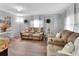 Comfortable living room with warm tones, two sofas, wood-look floors, and inviting decor at 714 E Michigan Ave, Deland, FL 32724