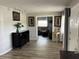 Inviting living room with wood-look flooring, decor, and a seamless flow to another room at 714 E Michigan Ave, Deland, FL 32724