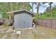 Backyard storage shed, with fence and some exterior items for yardwork at 714 E Michigan Ave, Deland, FL 32724