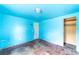 Light blue bedroom with wood floors and a closet at 126 Kensington Ave, Deland, FL 32724