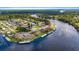 Stunning aerial view of a waterfront community with private boat docks and lush landscaping at 1640 Juno Trl # 205A, Astor, FL 32102