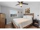 Comfortable bedroom with wood-look flooring, a ceiling fan, and natural light, perfect for relaxing at 1640 Juno Trl # 205A, Astor, FL 32102