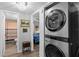 Convenient laundry area with stackable washer and dryer, next to a bedroom and bath for efficient living at 1640 Juno Trl # 205A, Astor, FL 32102