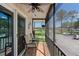 Relax on the porch with ceiling fan and enjoy the serene view from this cozy outdoor space at 1640 Juno Trl # 205A, Astor, FL 32102