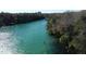 Scenic aerial view of the crystal-clear river winding through a lush landscape, a true natural paradise at 1640 Juno Trl # 205A, Astor, FL 32102