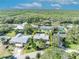 Aerial view of single-Gathering home with pool and lush landscaping at 4430 Doris Dr, New Smyrna Beach, FL 32169