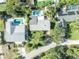 Aerial view of single-Gathering home with pool and backyard at 4430 Doris Dr, New Smyrna Beach, FL 32169