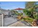 Concrete patio with seating area, lush landscaping, and shed at 4430 Doris Dr, New Smyrna Beach, FL 32169