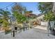 Private backyard patio with seating and a lush garden at 4430 Doris Dr, New Smyrna Beach, FL 32169