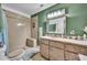 Clean bathroom with updated vanity and shower at 4430 Doris Dr, New Smyrna Beach, FL 32169