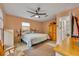 Spacious bedroom with ceiling fan and large bed at 4430 Doris Dr, New Smyrna Beach, FL 32169