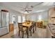 Dining area with a wooden table, four chairs, and access to the kitchen at 4430 Doris Dr, New Smyrna Beach, FL 32169