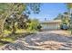 Brick paved driveway, garage, and basketball hoop in the backyard at 4430 Doris Dr, New Smyrna Beach, FL 32169