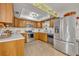 Updated kitchen featuring stainless steel appliances and wood cabinets at 4430 Doris Dr, New Smyrna Beach, FL 32169