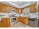 Modern kitchen with stainless steel appliances and white backsplash at 4430 Doris Dr, New Smyrna Beach, FL 32169