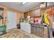 Laundry room with washer, dryer, and extra storage at 4430 Doris Dr, New Smyrna Beach, FL 32169