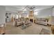 Spacious living room with tile floors, fireplace, and neutral decor at 4430 Doris Dr, New Smyrna Beach, FL 32169