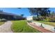 Landscaped backyard with boat and shed at 507 Dade Ct, Deltona, FL 32725