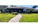 Brick house with screened porch and a stone pathway at 507 Dade Ct, Deltona, FL 32725