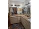 Large bathroom with dual sinks and granite countertops at 507 Dade Ct, Deltona, FL 32725