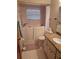 Main bathroom featuring walk-in shower and granite vanity at 507 Dade Ct, Deltona, FL 32725