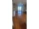 Bedroom with hardwood floors and access to the patio at 507 Dade Ct, Deltona, FL 32725
