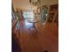Dining room with hardwood floors and a view into the living room at 507 Dade Ct, Deltona, FL 32725