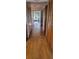 Long entryway with wood floors and built-in storage at 507 Dade Ct, Deltona, FL 32725