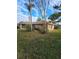 Brick house with partial view, landscaped yard at 507 Dade Ct, Deltona, FL 32725