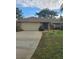 2-car garage, brick home with landscaping at 507 Dade Ct, Deltona, FL 32725