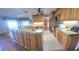 Open kitchen with island, granite counters & wood cabinets at 507 Dade Ct, Deltona, FL 32725