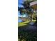 Peaceful waterfront view with a boat and lush landscaping at 507 Dade Ct, Deltona, FL 32725