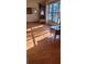 Sunlit living room with hardwood floors and large windows at 507 Dade Ct, Deltona, FL 32725